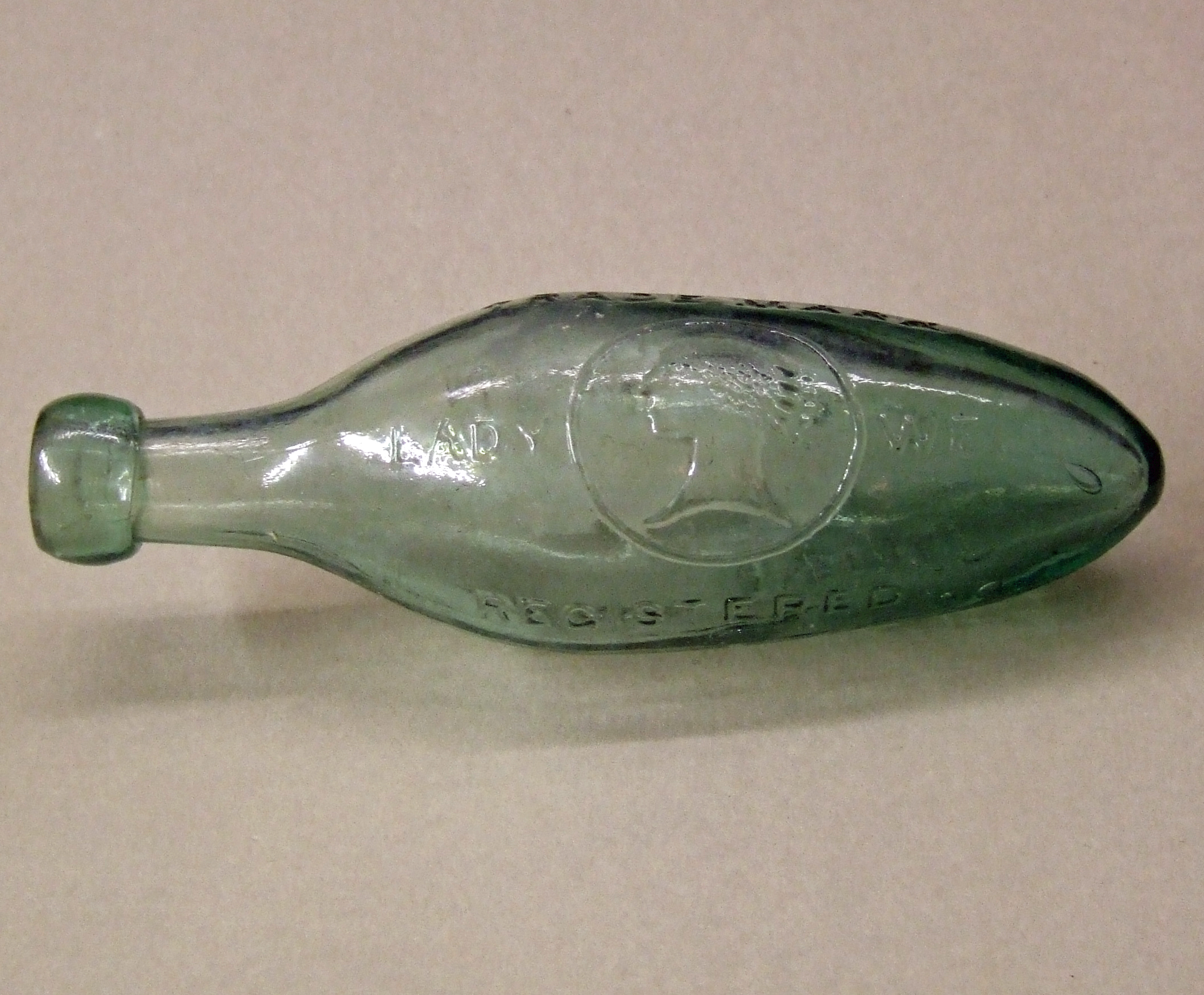 Green glass Torpedo bottle. Bill Bagley Glass